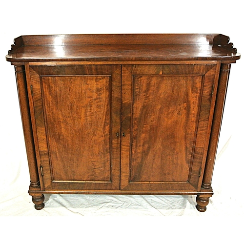 345 - Edwardian mahogany linen press with panelled doors, shelved interior, on round legs