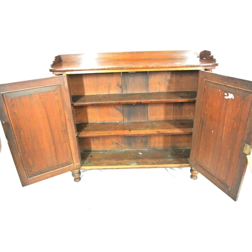 345 - Edwardian mahogany linen press with panelled doors, shelved interior, on round legs