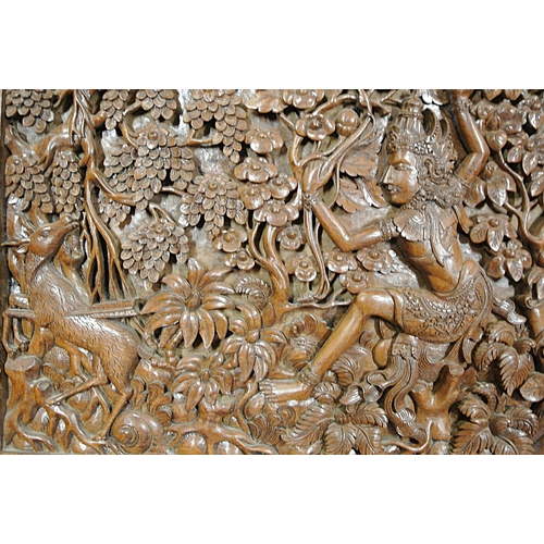 352 - Ornate Oriental carved teak panel with foliate figures & animal decoration