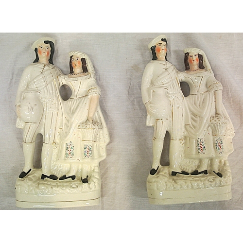 448 - Pair of Staffordshire figures of a lady and gent, on oval bases