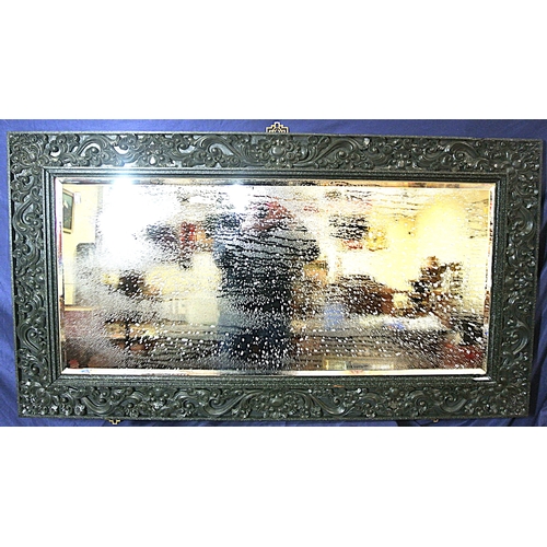 449 - Oriental carved timber framed bevelled glass wall mirror with ornate foliate and scroll decoration