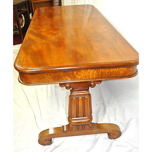 450 - Victorian mahogany oblong library table or hall table with rounded corners, on tapering columns, on ... 