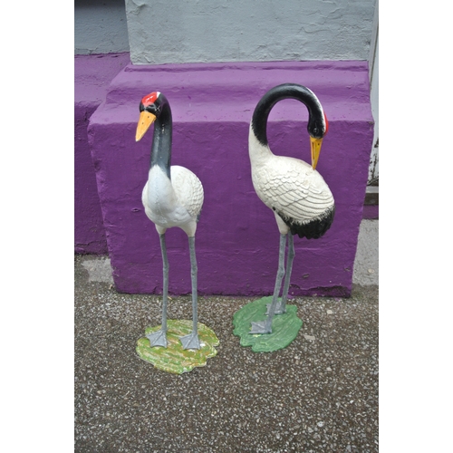 474 - Pair of vintage cast iron cranes with shaped bases H 75 x base 25 x20 cm