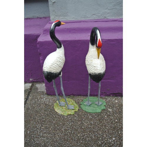 474 - Pair of vintage cast iron cranes with shaped bases H 75 x base 25 x20 cm