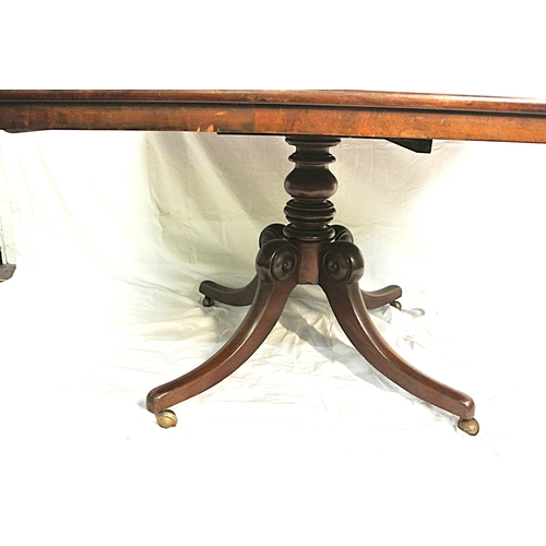 480 - Victorian mahogany square dining or library table with tip-up top, turned column, on hipped quadrapo... 