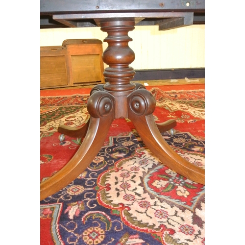 480 - Victorian mahogany square dining or library table with tip-up top, turned column, on hipped quadrapo... 