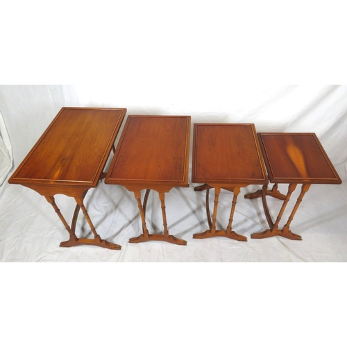 481 - Edwardian yew quartetto nest of 4 graduating tables with raised rims, turned columns, on bracket fee... 
