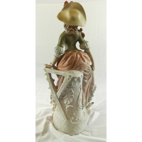 491 - Dresden style porcelain figure of a lady with fan, on scroll decorated base