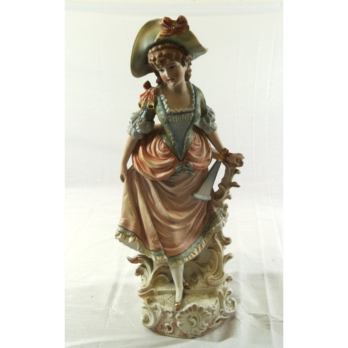 491 - Dresden style porcelain figure of a lady with fan, on scroll decorated base