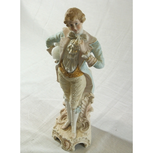 492 - Victorian style porcelain figure of a dandy gentleman on scroll decorated base