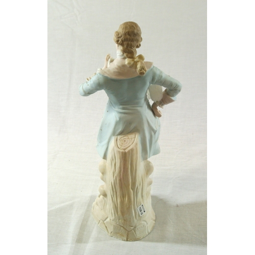492 - Victorian style porcelain figure of a dandy gentleman on scroll decorated base