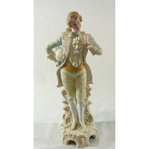 492 - Victorian style porcelain figure of a dandy gentleman on scroll decorated base