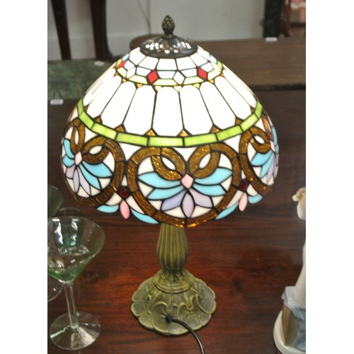 494 - Ornate electric table lamp with multi-panelled coloured shade & shaped base