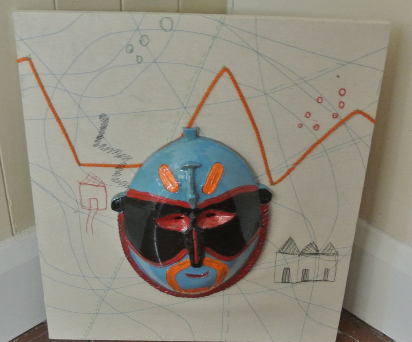 Ceramic mask on embroidered canvas, 42x38cm
