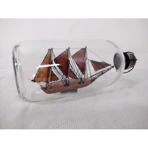 44 - Mid-20th Century Ship in a Bottle with Three-Masted Schooner, Housed in a Clear Glass Bottle with Wo... 