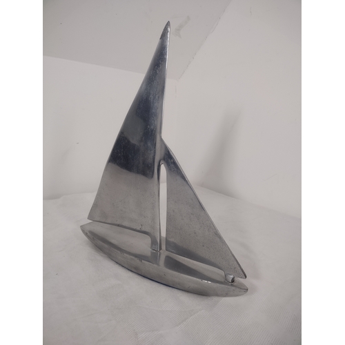 69 - Mid-20th Century Aluminium Sailboat Sculpture Featuring Minimalist Nautical Design.