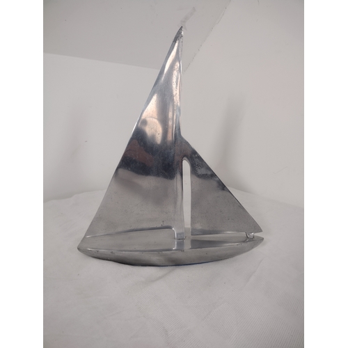 69 - Mid-20th Century Aluminium Sailboat Sculpture Featuring Minimalist Nautical Design.