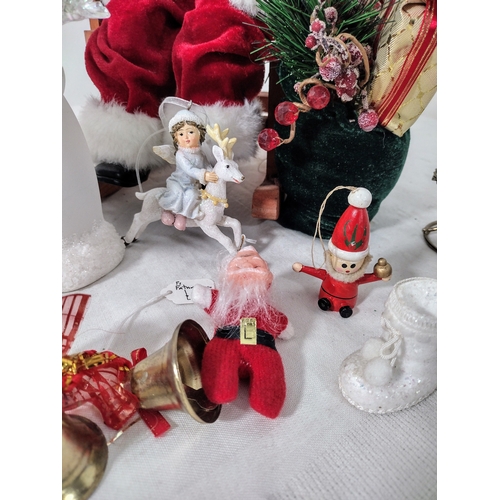 38 - Festive Christmas Lot Featuring Large Santa on Rocking Chair, Snowman Candle Holder,  Bells, Tree To... 