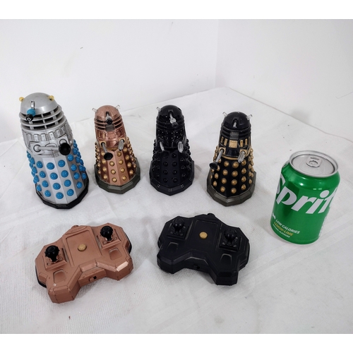 103 - Set of Four Doctor Who Daleks with Two Remote Control Units, Including Classic and Modern Designs, 2... 