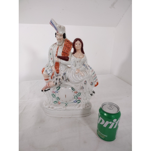 182 - Victorian Staffordshire Flatback Figurine of Highlander with Bagpipes and Companion, Circa 1860–1880