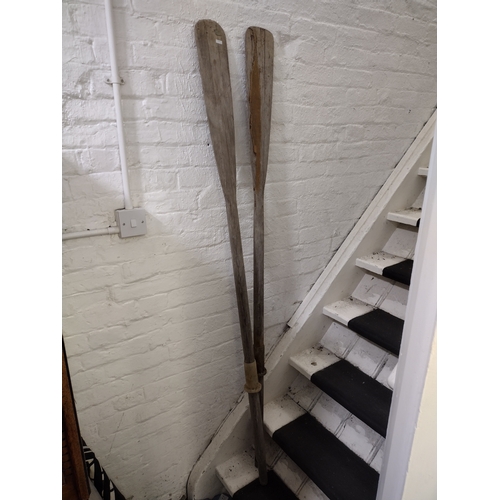 252 - Pair of Early to Mid-20th Century Wooden Rowing Oars with Plastic Collars, Approx. 140cm in length