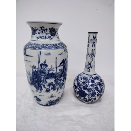 73 - Two Vintage Oriental Blue and White Porcelain Vases approx 10 Inches and 11 Inches tall