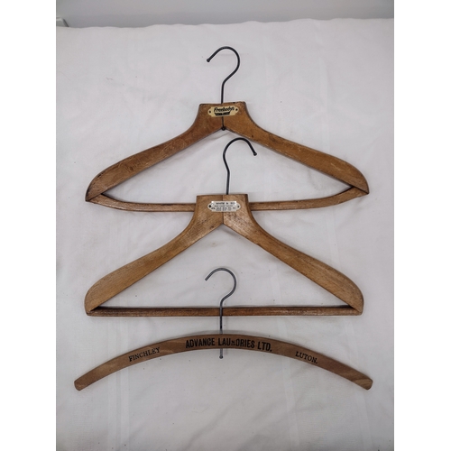 93 - Set of Three Vintage Branded Wooden Hangers Featuring Freebody’s, A. White & Son, and Advance Laundr... 