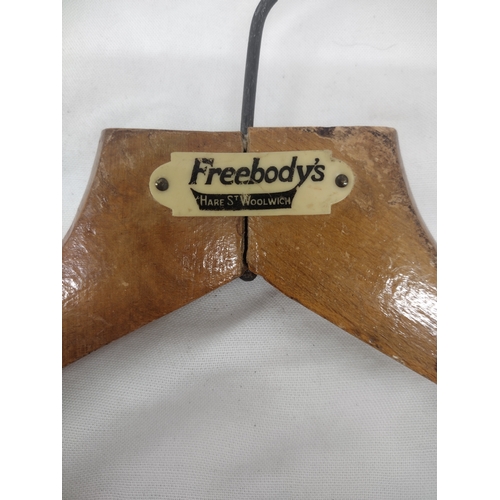 93 - Set of Three Vintage Branded Wooden Hangers Featuring Freebody’s, A. White & Son, and Advance Laundr... 