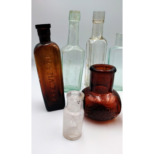 473 - Collection of Vintage Glass Bottles, Including Café Vierge, Bovril, Davidson, and Table Spoon Measur... 