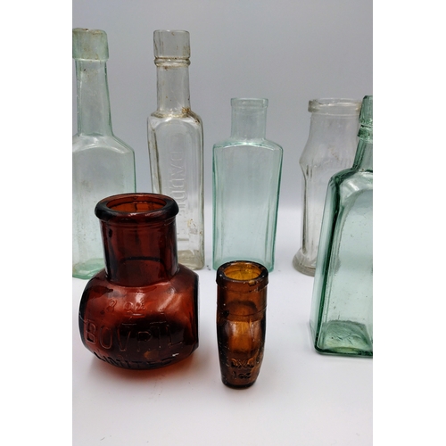 473 - Collection of Vintage Glass Bottles, Including Café Vierge, Bovril, Davidson, and Table Spoon Measur... 