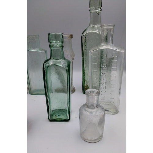 473 - Collection of Vintage Glass Bottles, Including Café Vierge, Bovril, Davidson, and Table Spoon Measur... 