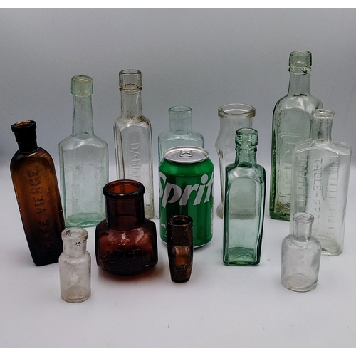 473 - Collection of Vintage Glass Bottles, Including Café Vierge, Bovril, Davidson, and Table Spoon Measur... 