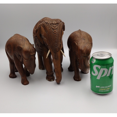 257 - Trio of Teak Carved Elephants One Male 2x Females - Largest approx 21cm high 20cm in length