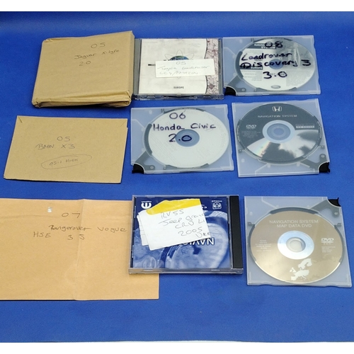 201 - Collection of Approx. 35 OEM Car Navigation Discs for Various Brands, 2004–2009, Including Audi, BMW... 