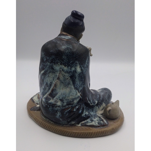 429 - Mid-20th Century Shiwan Mudman Figurine, Circa 1950s, Depicting a Seated Scholar Drinking Tea with T... 