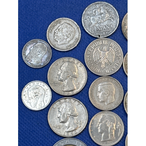 75 - A collection of Silver and Silver Toned Coins Mostly European Ranging From 1907 to 1992