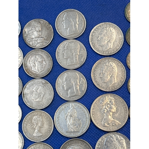 75 - A collection of Silver and Silver Toned Coins Mostly European Ranging From 1907 to 1992