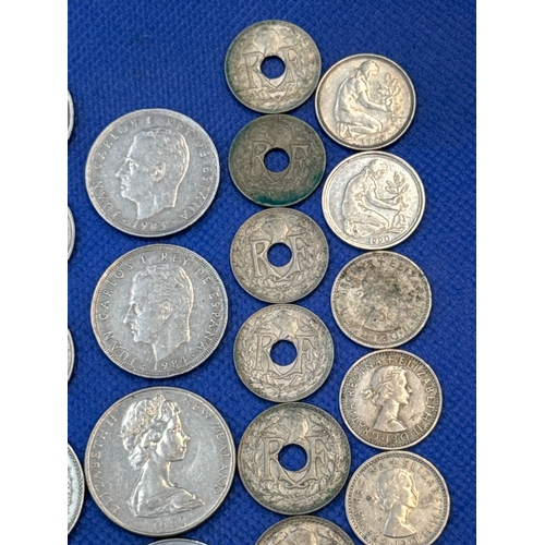 75 - A collection of Silver and Silver Toned Coins Mostly European Ranging From 1907 to 1992