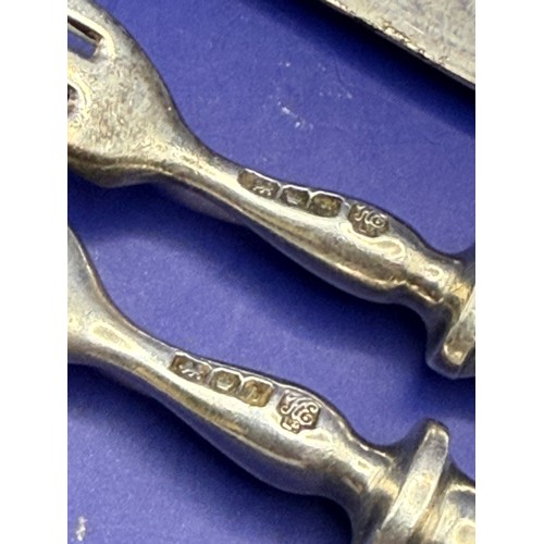 20 - Two Sterling silver Forks , Two Silver Spoons , One Silver Knife and One Silver Handled Steel Blade ... 
