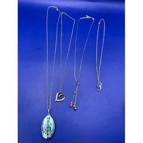 23 - Four Sterling Silver Chains with Pendants est 12g 925