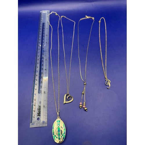 23 - Four Sterling Silver Chains with Pendants est 12g 925