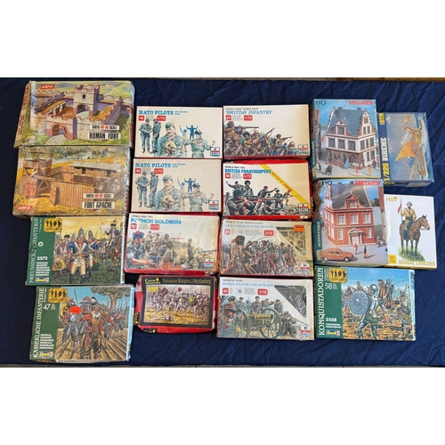A collection of fifteen vintage model kits and figure sets by Airfix, ESCI, Revell, and others