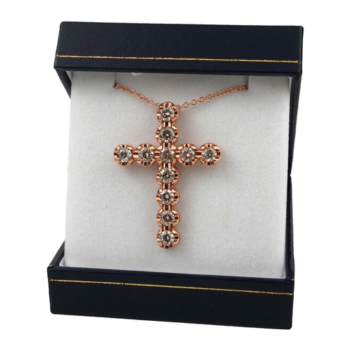 4 - A 9CT ROSE GOLD CROSS, SET WITH ROUND BRILLIANT CUT DIAMONDS on a 9ct rose gold chain.  
(Diamonds 3... 