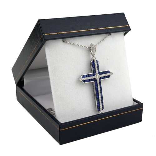 26 - AN 18CT WHITE GOLD, SAPPHIRE AND DIAMOND CROSS.
(Sapphires 5.35ct, Diamonds 0.63ct)