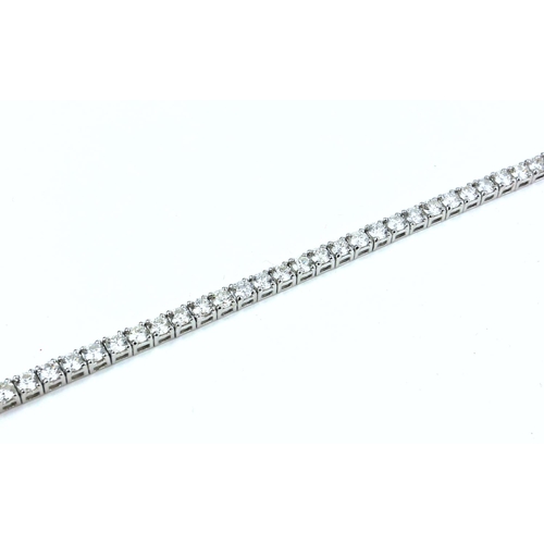 40 - AN 18CT WHITE GOLD ROUND BRILLIANT CUT DIAMOND LINE BRACELET.  
(Diamonds 8.20ct) Boxed.