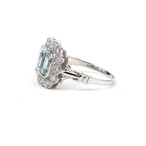 52 - AN 18CT WHITE GOLD THREE STONE AQUAMARINE AND DIAMOND DRESS RING.  (Aquamarine 2.10ct, Diamonds 0.26... 