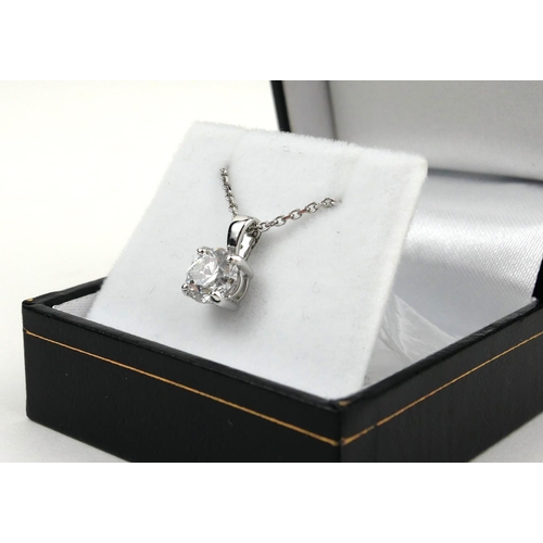 45 - AN 18CT WHITE GOLD FOUR CLAW ROUND BRILLIANT CUT DIAMOND PENDANT on a white gold chain.  (Diamonds 1... 