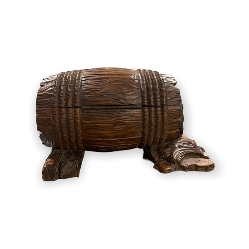 113 - A RARE 19TH CENTURY GUÉRET FRÈRES, PARIS, CARVED LIMEWOOD LIQUOR BOX FORMED AS A BARREL, GUARDED BY ... 