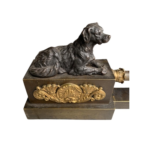 125 - AN EARLY 19TH CENTURY FRENCH BRONZE AND ORMOLU MOUNTED FIRE CHENET 
With two recalling Spaniel dogs.... 