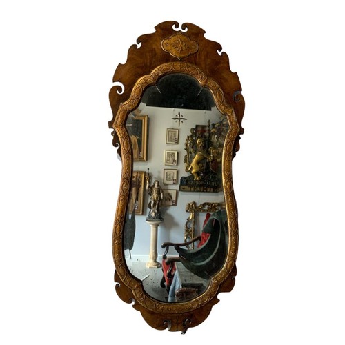 168 - A PAIR OF GEORGE III FLAME MAHOGANY AND PARCEL GILT WALL MIRROR
The central cartouche and scrolling ... 